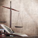 Justice Scales and books and wooden gavel on table. Justice concept