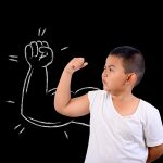 The boy showed his muscle strength.